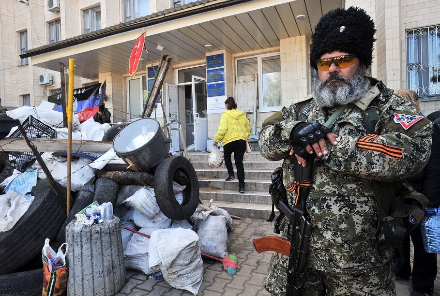 A pro-Russian militant guards a barricade outside Kramatorsk City Hall in 2014.