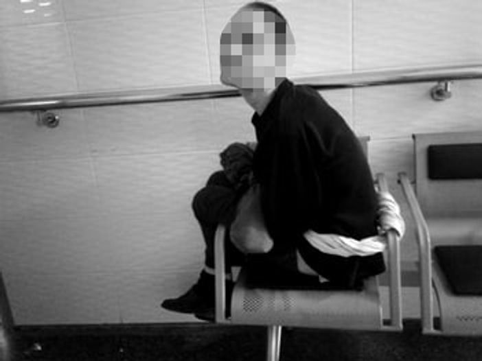 Psychiatric care home resident tied to a chair