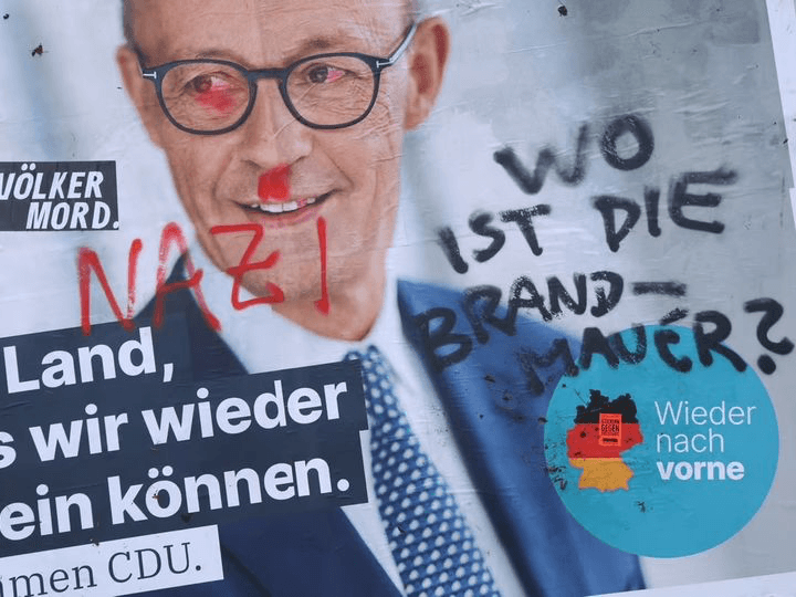 CDU election poster covered in graffiti. Photo: Sean Gallup / Getty Images
