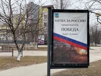 A banner reading 'The battle for Russia continues, Victory will be ours!'