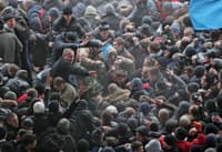 The confrontation between supporters of Ukrainian unity and pro-Russian activists outside the Crimean Supreme Council building in Simferopol, Ukraine, on February 26, 2014.  