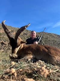 Vasily Shestakov posing with a dead animal in Spain
