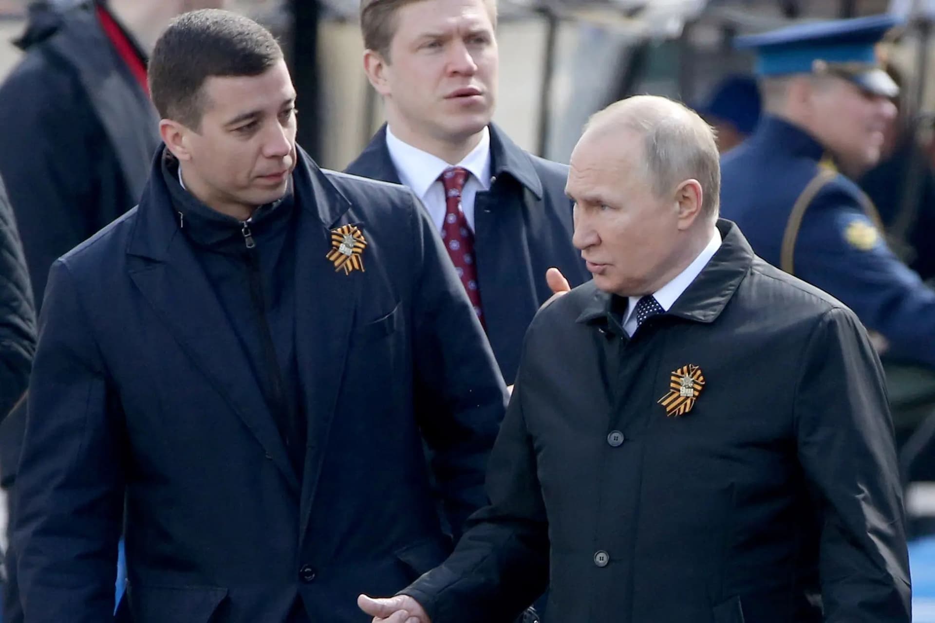 Dmitry Kovalev and Vladimir Putin at the Victory Day parade in Moscow