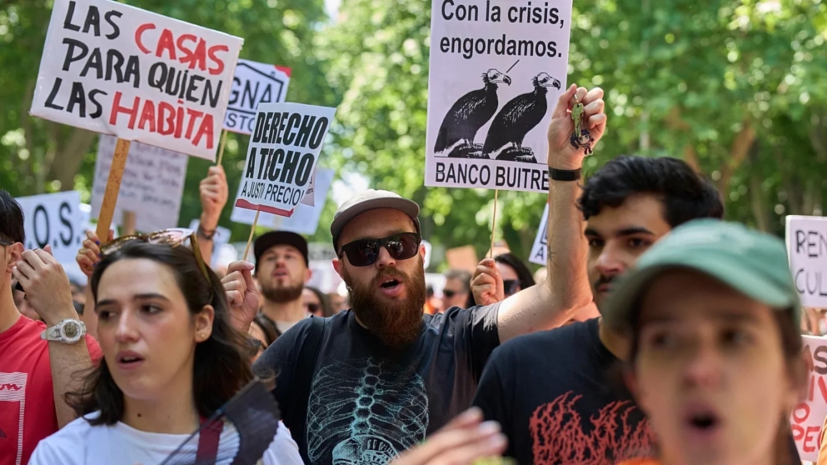 "Homes are for those who live in them" reads a placard at a protest against rising housing prices in Madrid, Spain, May 24, 2026