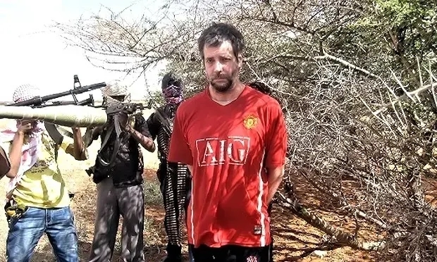 Michael Scott Moore surrounded by his captors