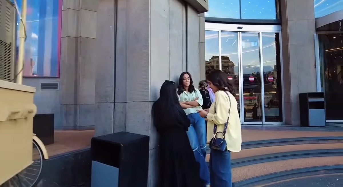 Young women ignoring the requirement to wear headscarves