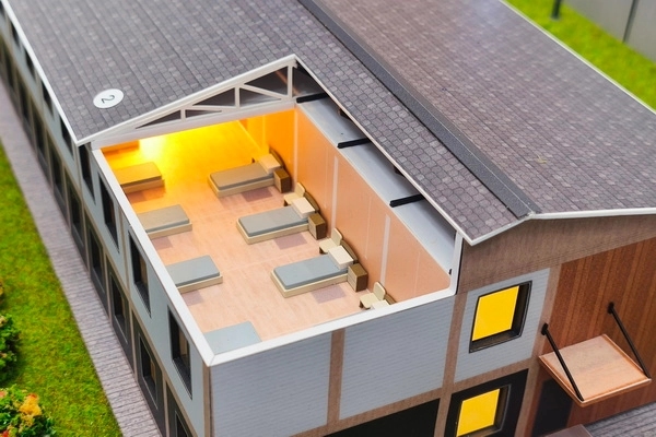 A model of a “quickly deployable” correctional center for people sentenced to forced labor showing the inside of the facility