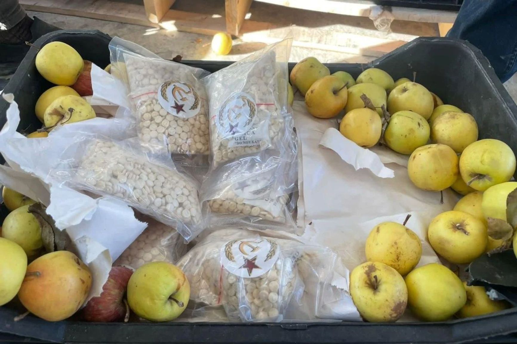 Captagon tablets hidden in boxes of apples were found at the Al-Qaim checkpoint between Syria's Deir ez-Zor province and Iraq's western Anbar desert region in 2023.