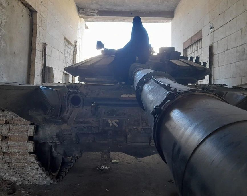One of The Insider's interviewees on an abandoned Russian tank. Photo from personal archive