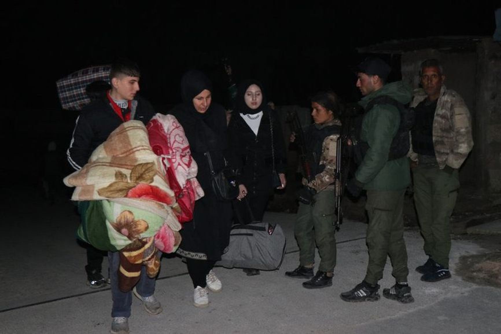 Kurds in Aleppo are leaving their homes following the militants' advance. They are being assisted by Kurdish self-defense units patrolling the Sheikh Maqsoud district.