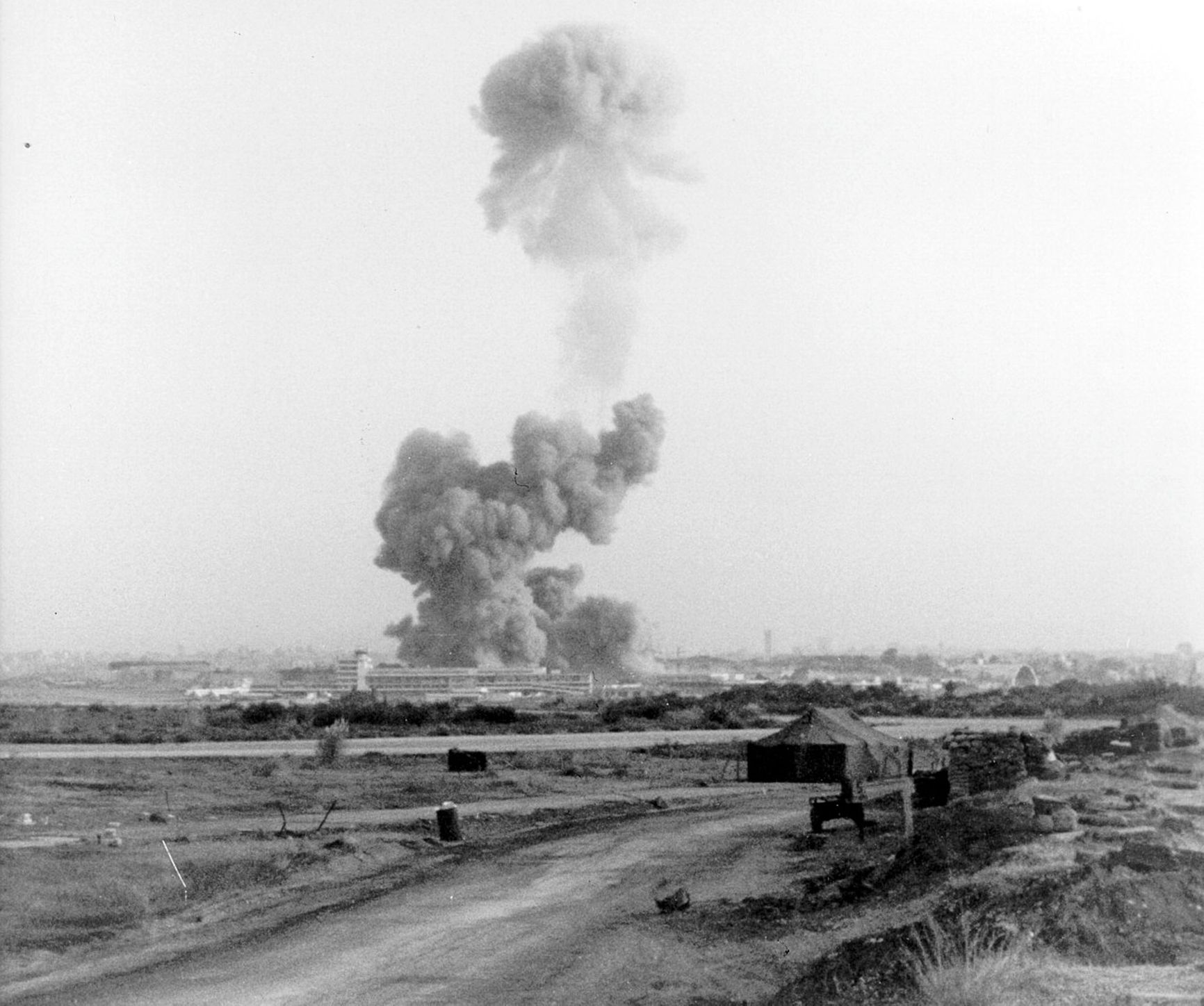 A column of smoke over the U.S. Marine Corps Headquarters in Beirut, October 23, 1983