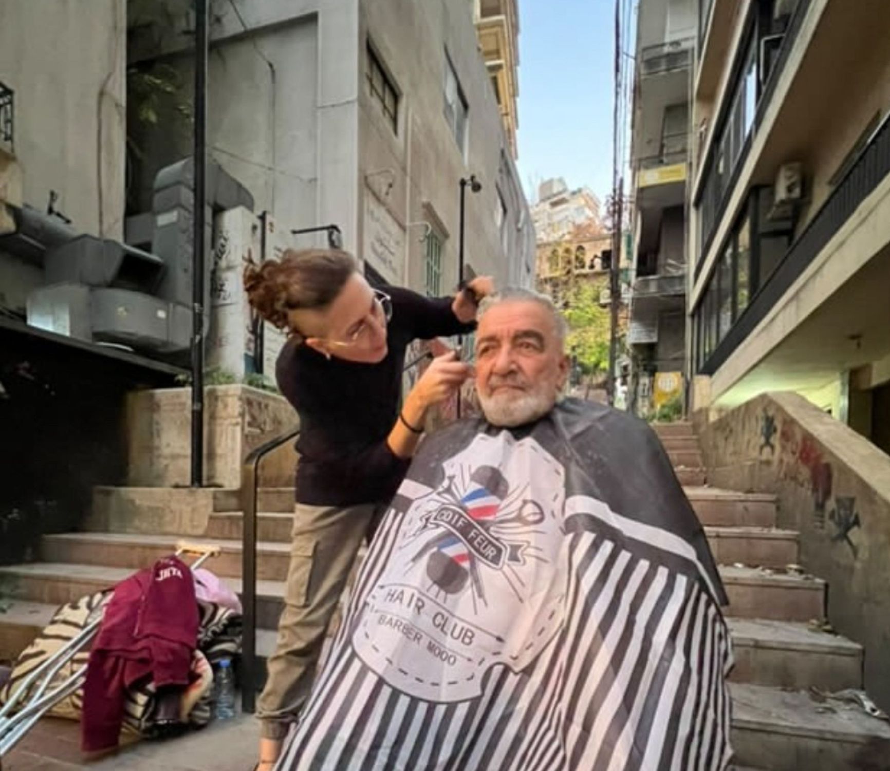 Volunteers from Project on the Streets offer free haircuts